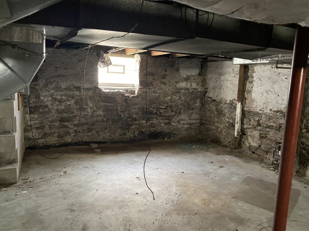Old stone basement cleared out by Clear The Clutter