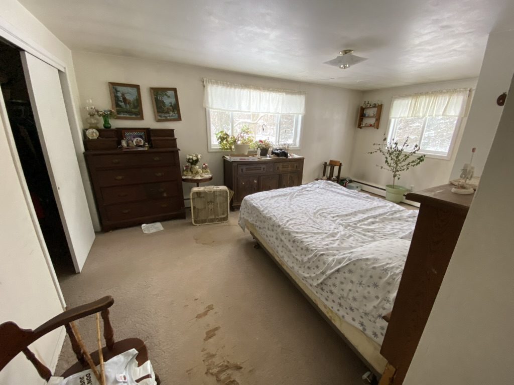 Estate cleanout bedroom before - furniture and belongings to be removed