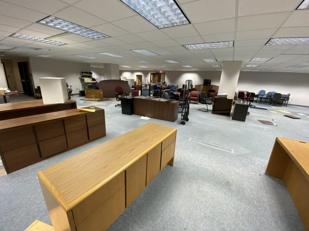 Office furniture removal - desks and chairs in commercial space