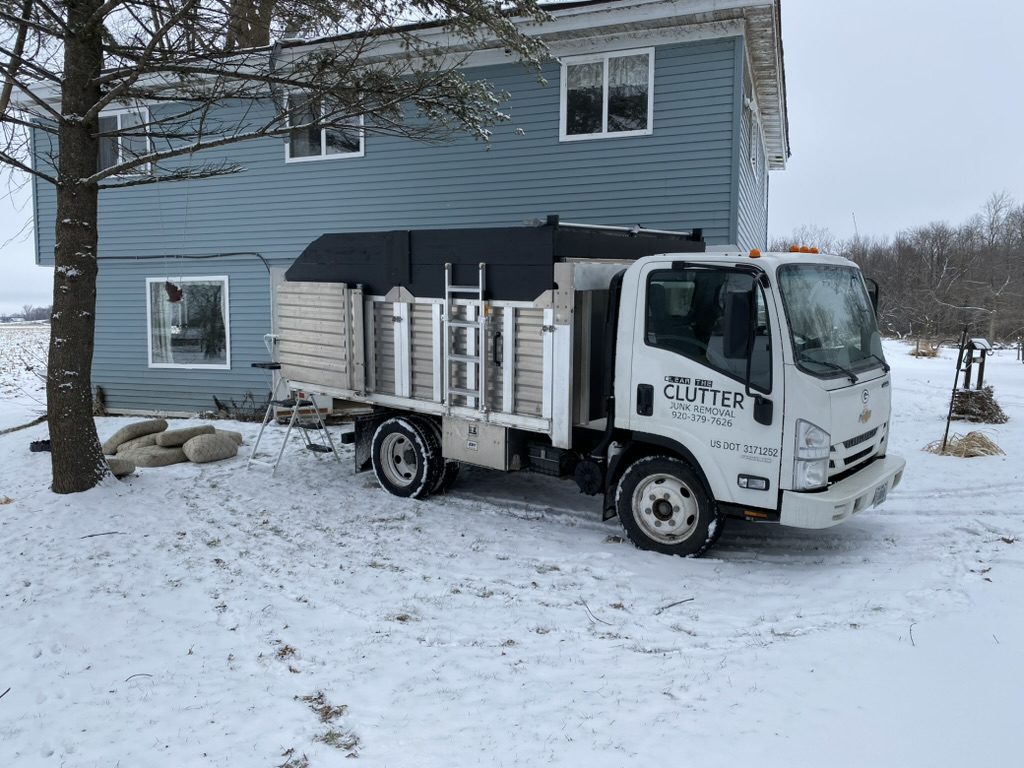 Clear The Clutter truck on-site for winter junk removal job