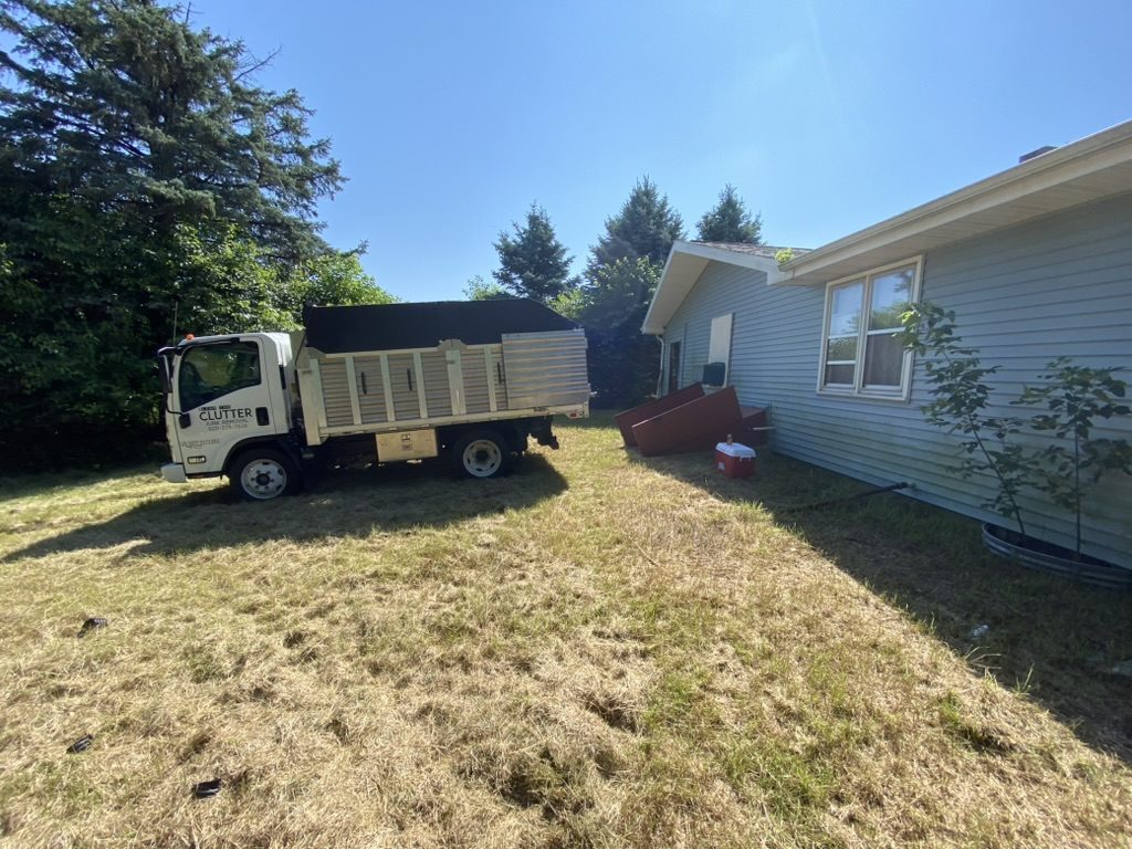 Clear The Clutter junk removal truck at residential job in Fox Valley WI