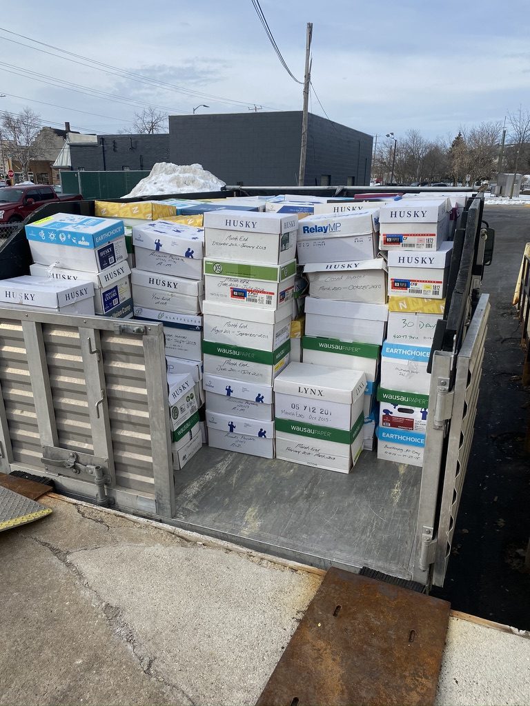 Dump trailer loaded with commercial paper and boxes for recycling