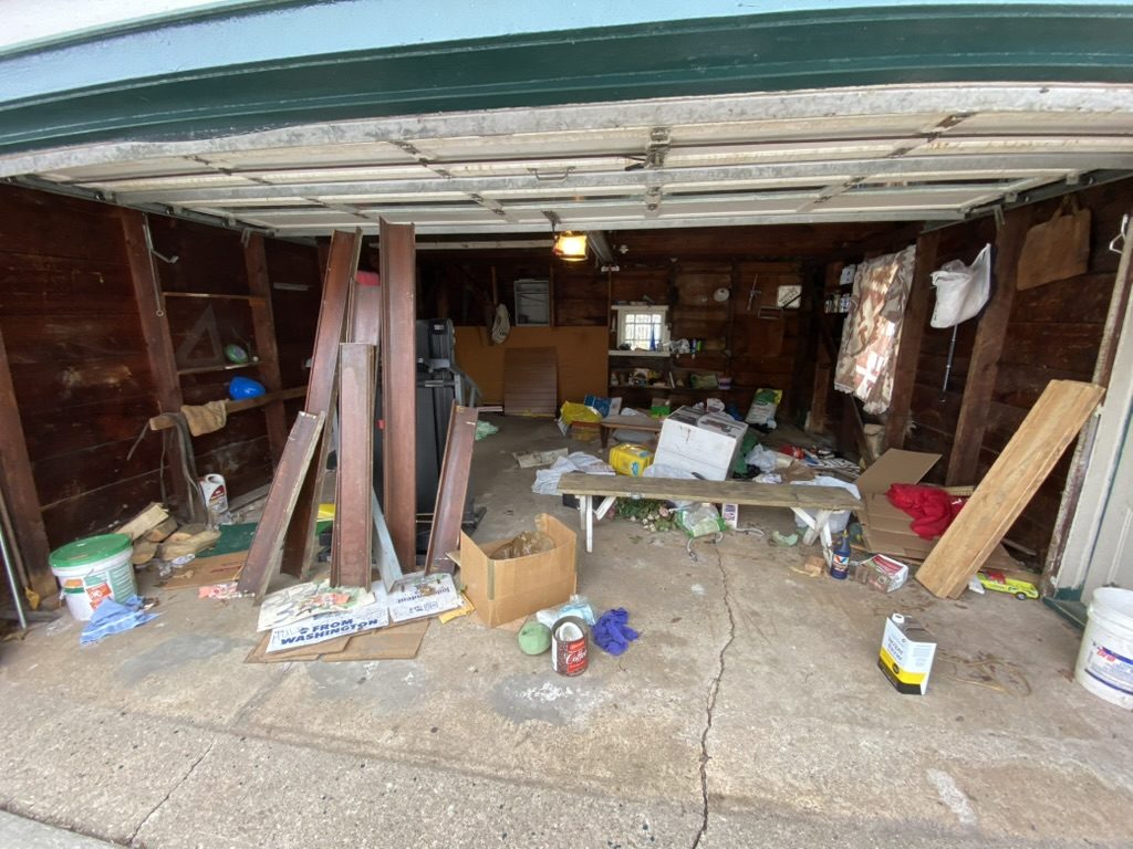 Garage full of junk before cleanout service